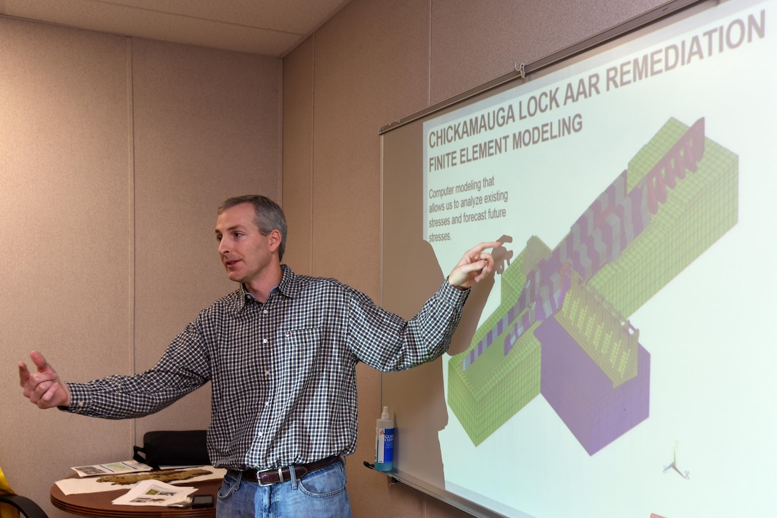 Adam Walker, U.S. Army Corps of Engineers Nashville District project manager for the Chickamauga Lock Replacement Project, briefs Douglas Lamont, senior official performing duties of secretary of the Army for Civil Works, on the benefit of a new computer model that allows the Nashville District to analyze existing stresses and forecast future stresses where the lock has experienced structural problems resulting from alkali aggregate reaction between the alkali in the cement and the rock aggregate.  The reaction results in a physical expansion of concrete structures.  The briefing took place at the Chickamauga Lock Replacement Project Resident Engineer Office at Chickamauga Dam in Chattanooga, Tenn., Feb. 28, 2017. 