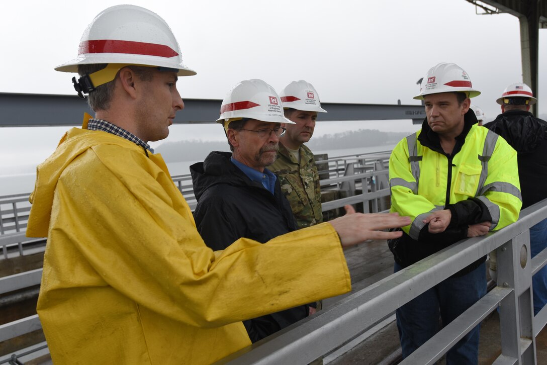 Adam Walker (Left), Chickamauga Lock Replacement Project manager; Tommy Long (Right), resident engineer; Lt. Col. Stephen Murphy (Second from Right), U.S. Army Corps of Engineers Nashville District commander; give a project update to Douglas Lamont, senior official performing duties of secretary of the Army for Civil Works, during his visit to the project on the Tennessee River in Chattanooga, Tenn., Feb. 28, 2017.  The Tennessee Valley Authority owns the dam while the Nashville District operates and maintains the current lock.