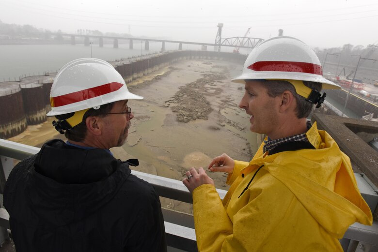 Adam Walker (Right), U.S. Army Corps of Engineers Nashville District project manager for the Chickamauga Lock Replacement Project, briefs Douglas Lamont, senior official performing duties of secretary of the Army for Civil Works, on the status of the work Feb. 28, 2017 in Chattanooga, Tenn. The Tennessee Valley Authority owns the dam while the Nashville District operates and maintains the current lock. 
