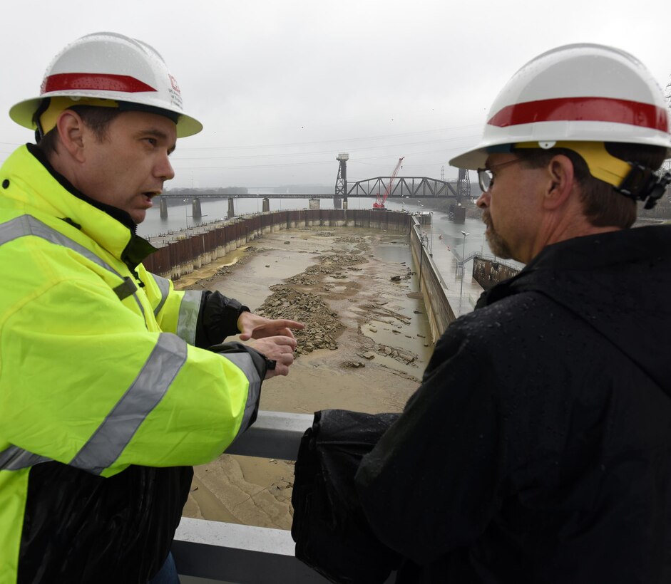 Tommy Long (Left), resident engineer for the Chickamauga Lock Replacement Project, explains how the river bed will be excavated ahead of future construction of the new 110-foot by 600-foot navigation lock to Douglas Lamont, senior official performing duties of secretary of the Army for Civil Works, during his visit to the lock on the Tennessee River in Chattanooga, Tenn., Feb. 28, 2017. 