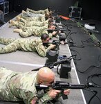 Soldiers assigned to Headquarters Support Company, Headquarters, Headquarters Battalion, U.S. Army North (Fifth Army) challenged their marksmanship abilities on the Engagement Skills Trainer at Joint Base San Antonio-Fort Sam Houston Feb. 22. Soldiers practiced firing and qualifying with the M9 pistol and M16 rifle to ensure every Soldier was familiar with the weapons. Once complete with qualification, Soldiers engaged in shoot/don't shoot scenario based training. Using the E.S.T. simulator has benefits of allowing firers the opportunity for increased training without the added cost of ammunition and other logistical requirements.