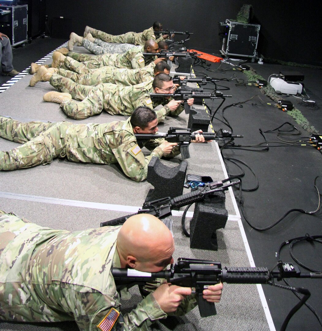 Members from the 17th Special Tactics Squadron, Fort Beinning, GA, teach  civilians how to don special tactics equipment before the Arizona Cardinals  Salute to Service game, Nov. 18, 2018, at the State