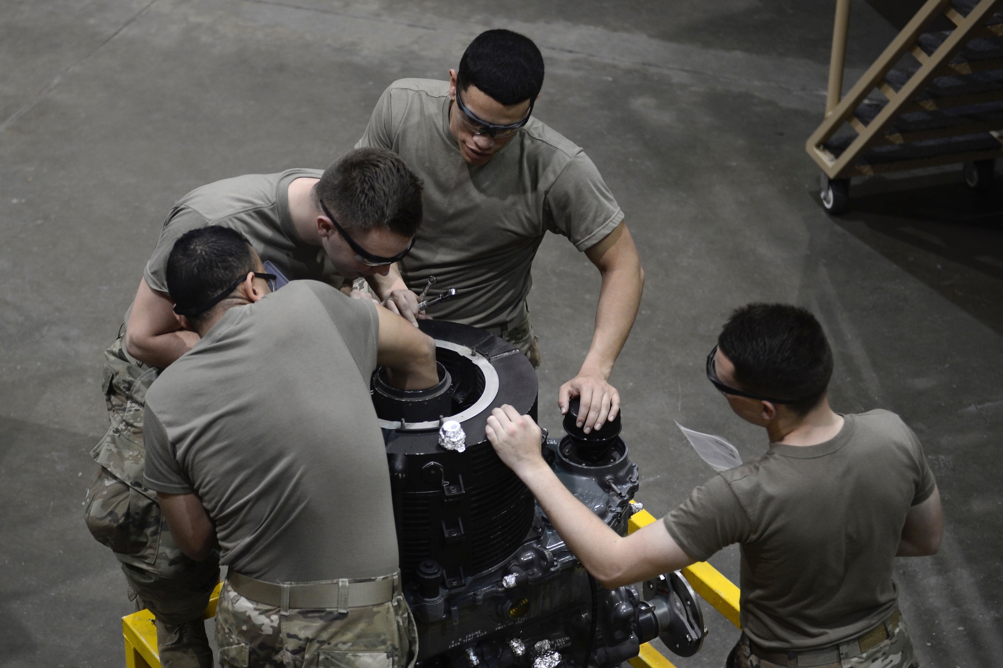 U.S. Army students with the 128th Aviation Brigade repair the mechanics of a CH-47 Chinook propeller at Joint Base Langley-Eustis, Va., Feb. 24, 2017. Along with Chinook, students can work on full size AH-64 Apache and UH-60 Black Hawk, as well as train on virtual aircraft. (U.S. Air Force photo by Airman 1st Class Kaylee Dubois)