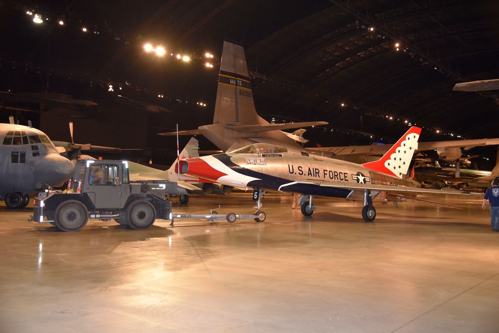 DAYTON, Ohio -- The North American F-100D Super Sabre  being moved into position in the Cold War Gallery at the National Museum of the United States Air Force. The restoration crew members worked as part of a team to complete the gallery reconfiguration on Jan. 26, 2017. (U.S. Air Force photo)