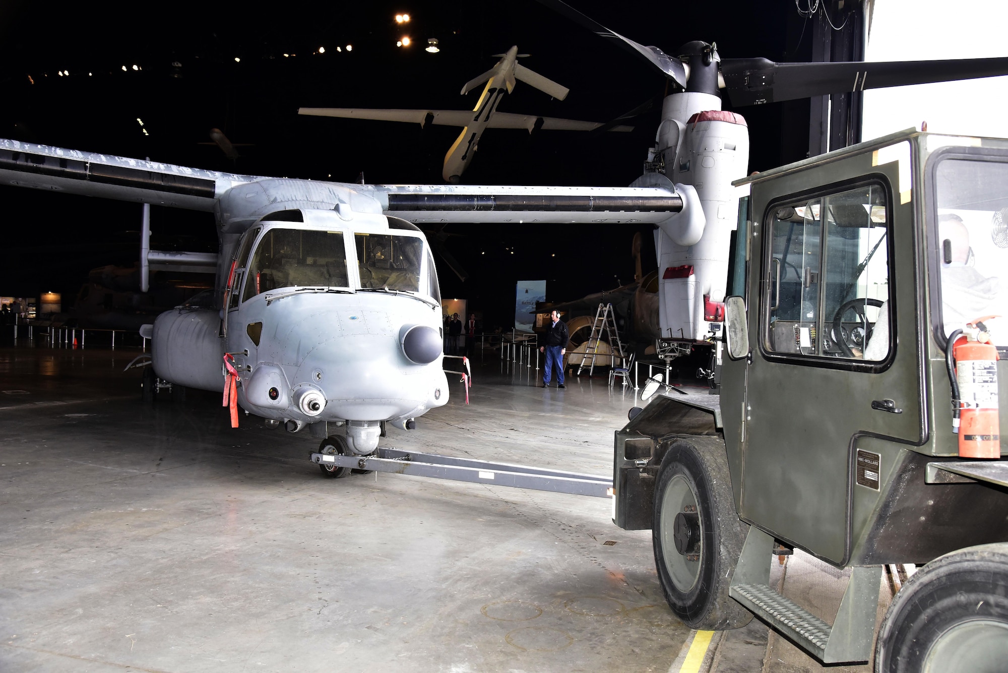 DAYTON, Ohio -- Bell-Boeing CV-22B Osprey being moved into position in the Cold War Gallery at the National Museum of the United States Air Force. This restoration crew member worked as part of a team to complete the gallery reconfiguration on Jan. 26, 2017. (U.S. Air Force photo)