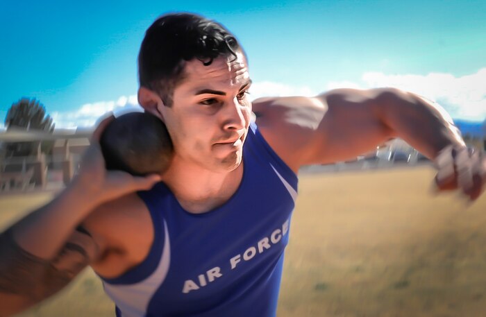 An Air Force Wounded Warrior Trials competitor throws a shot-put during the AFW2 at Nellis Air Force Base, Nev., Feb. 28, 2017. The AFW2 Airmen also compete in wheelchair basketball, wheelchair rugby, sitting volleyball, swimming, track and field, air pistol and rifle shooting, archery and cycling. (U.S. Air Force photo by Airman 1st Class Kevin Tanenbaum/Released)