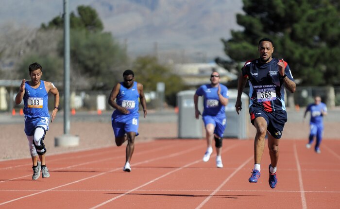 Air Force Wounded Warrior Trials athlete’s race towards the finish line during the field competition of the AFW2 at Nellis Air Force Base, Nev., Feb. 28, 2017. The AFW2 Program's goal is to assist injured, ill and wounded-in-action Airmen. (U.S. Air Force photo by Airman 1st Class Kevin Tanenbaum/Released)
