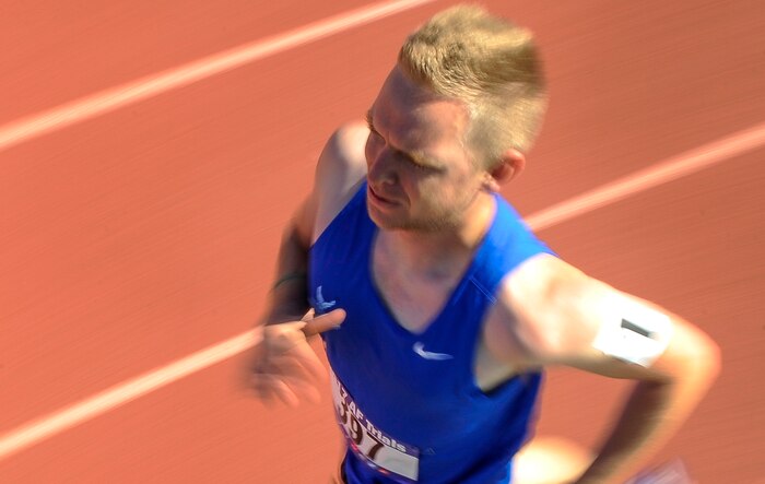 An Air Force Wounded Warrior Trials athlete rounds a turn during the men’s 400-meter race of the AFW2 at Nellis Air Force Base, Nev., Feb. 28, 2017. The trials will last through March 2, during which time athletes will compete in seven events including archery, basketball, cycling, track and field, swimming, shooting and volleyball. (U.S. Air Force photo by Airman 1st Class Kevin Tanenbaum/Released)