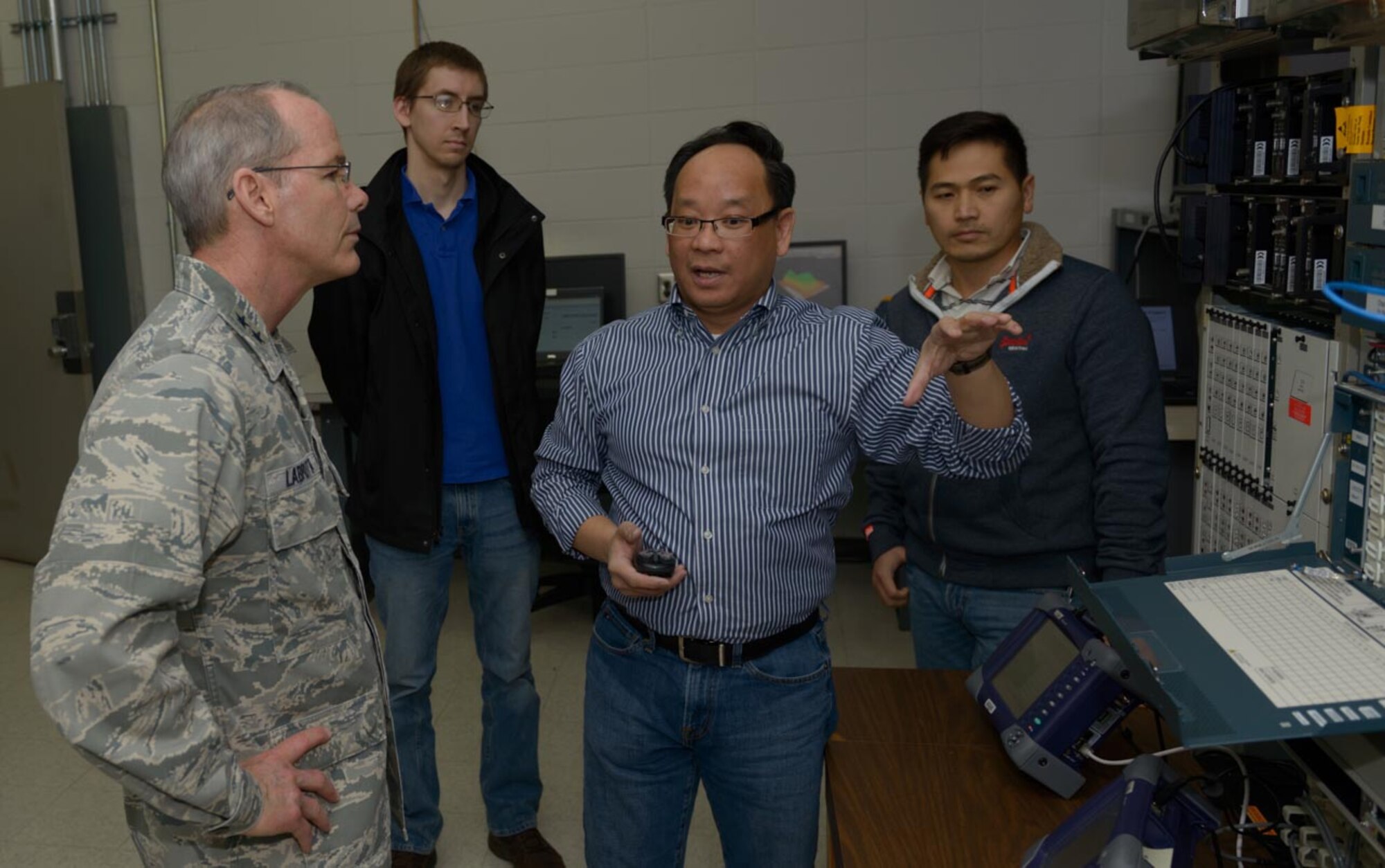 Peter Bui, 85th Engineering Installation Squadron senior electronics engineer, explains network testing lab equipment to Maj. Gen. Robert LaBrutta, 2nd Air Force commander, during a 2nd AF immersion tour of the unit located at Keesler Air Force Base, Miss., Feb. 9, 2017. The Airmen at the 85th EIS are part of the only active duty EIS in the Air Force. During contingencies, the 85th EIS Airmen can deliver their unique skills to the warfighter within 72 hours - anywhere in the world, which is why their motto is, "With Pride, Worldwide!" (U.S. Air Force photo by Andre’ Askew)