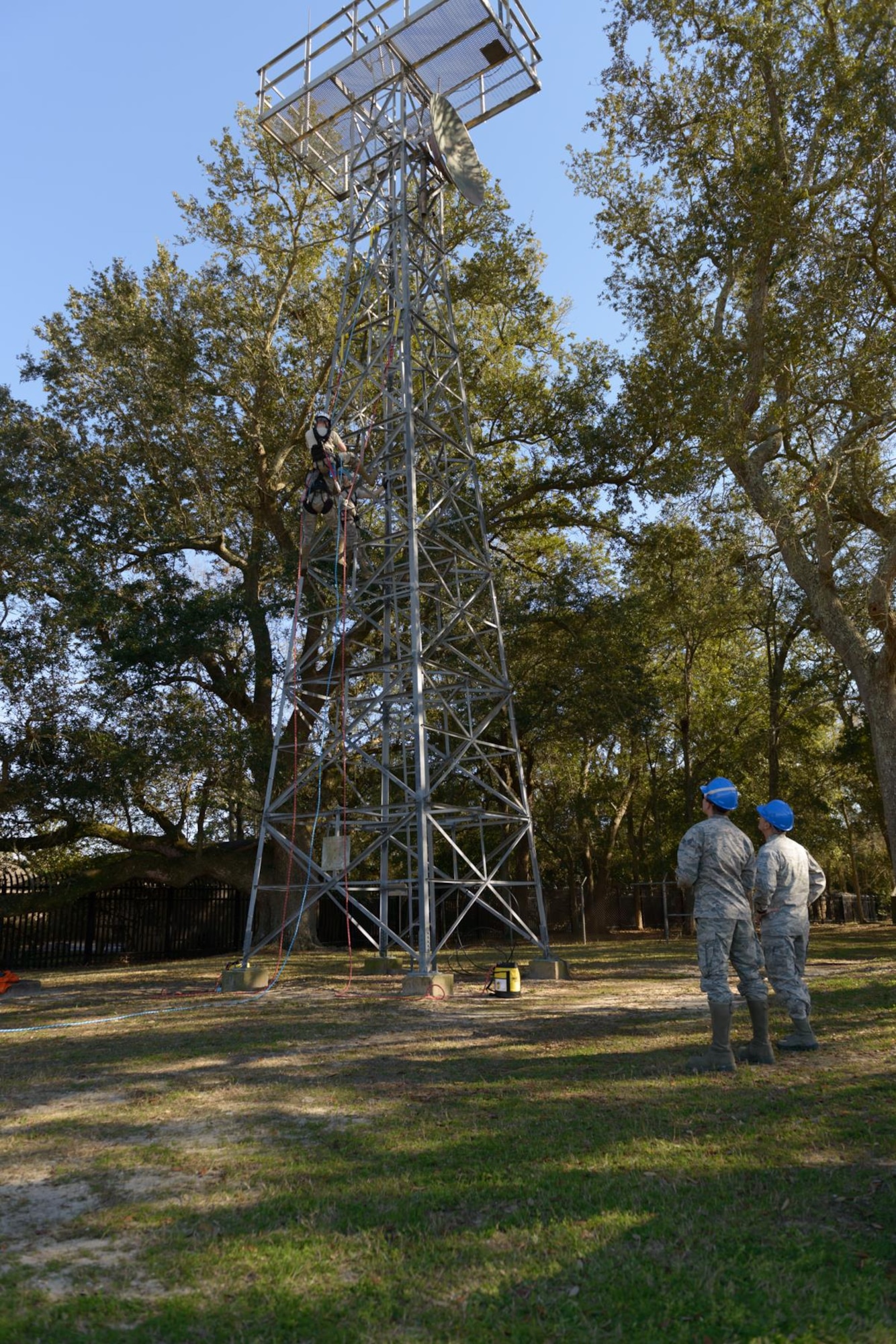 Maj. Gen. Robert LaBrutta, 2nd Air Force commander, and Senior Airman Chase Kiefer, 85th Engineering Installation Squadron cable and antenna systems technician, discuss tower rescue procedures during a 2nd AF immersion tour of the unit located at Keesler Air Force Base, Miss., Feb. 9, 2017. The Airmen at the 85th EIS are part of the only active duty EIS in the Air Force. They are also the only organization in the Defense Department providing specialized engineering services such as electromagnetic hazard and interference investigations and High Altitude Electromagnetic Pulse protection. (U.S. Air Force photo by Andre’ Askew)