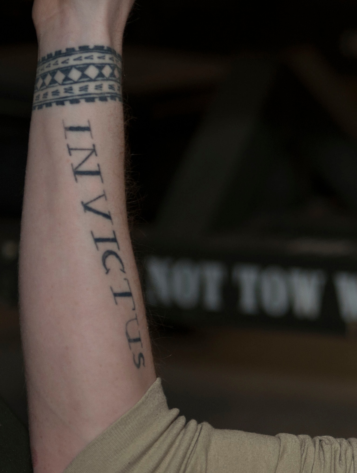 U.S. Air Force Senior Airman Daniel Brewer, 7th Munitions Squadron armament maintenance technician, shows off two of his five tattoos at Dyess Air Force Base, Texas, Jan. 6, 2016. Brewer has gotten one tattoo each year since the age of 16. (U.S. Air Force photo by Airman 1st Class April Lancto)

