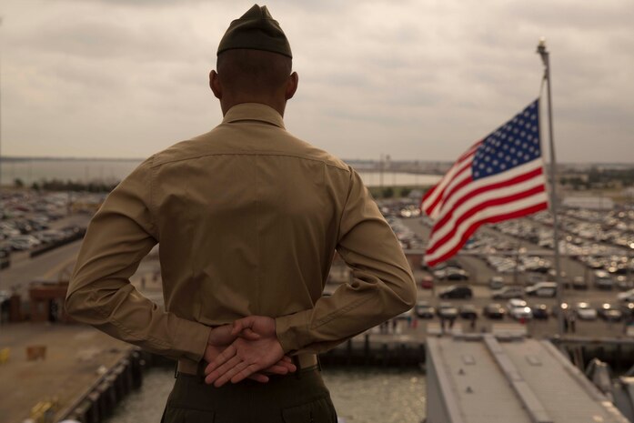 Marines and sailors with the 24th Marine Expeditionary Unit man the rails as amphibious assault ship USS Bataan (LHD 5) prepares to go underway for deployment March 1, 2017. The 24th MEU will operate in Europe and the Middle East in the coming months providing crisis response and contingency support for combatant commanders, including maritime security operations, humanitarian assistance, and advance force operations. (U.S. Marine Corps photo by Lance Cpl. Autmn Bobby)