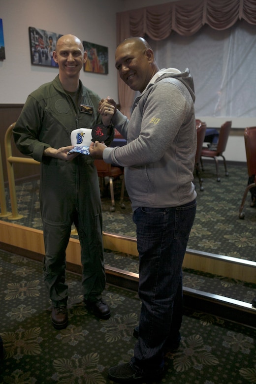 Capt. Tobin Lewis receives a Yokohama DeNA BayStars hat from the team’s manager Alex Ramirez Feb. 24 on Marine Corps Air Station Futenma, Okinawa, Japan. The BayStars baseball team were able to tour an MV-22B Osprey and visit with Marines. “Events like this help create a sense of pride in the local community among Marines, sailors and civilians who live and work aboard MCAS Futenma,” said Lt. Col. Bob Sweginnis, the executive officer of MCAS Futenma. “They go a long way toward knocking down boundaries, dispelling myths and building mutual appreciation and understanding between those on both sides of the air station gates.”
Lewis is a MV-22B Osprey pilot with Medium Tiltrotor Squadron 265, Marine Aircraft Group 36, 1st Marine Air Wing. (U.S. Marine Corps Photo by Cpl. Jessica Collins)
