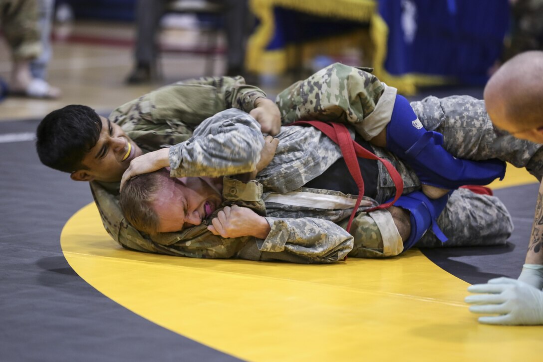 Army 1st Lt. Nathan Santhanam fights an opponent for the lightweight champion title during the Fight Tonight Challenge, an Army combatives tournament at Camp Walker, South Korea, Feb. 24, 2017. Santhanam is assigned to the 6th Ordnance Battalion. Army photo by Sgt. Uriah Walker