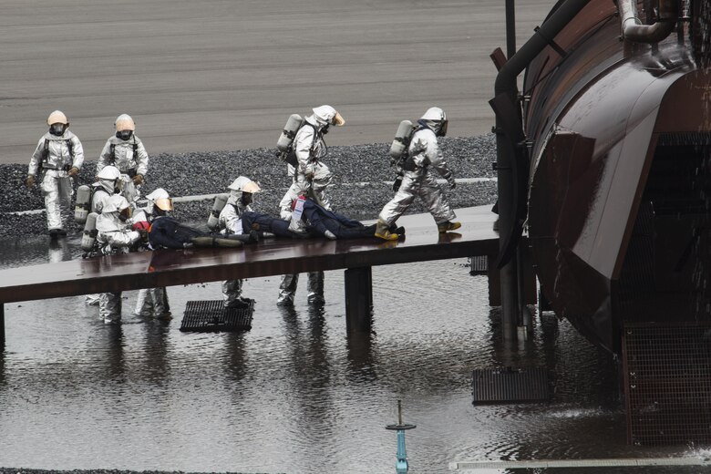 U.S. Marines, Sailors and Japanese Maritime Self-Defense Force personnel conducted a mass casualty exercise on Marine Corps Air Station Iwakuni, Japan, March 1, 2017. The exercise assessed the air station’s initial response, incident management, activation of emergency operations center and mass casualty plan in the event of a downed aircraft. (U.S. Marine Corps photo by Lance Cpl. Joseph Abrego)