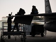 Airmen from the 18th Maintenance Squadron maintain an F-15C Eagle Mar. 2, 2017, at Kadena Air Base, Japan. Maintenance Airmen require precise attention to detail since proper maintenance can mean the difference between mission success and failure. (U.S. Air Force photo by Senior Airman Omari Bernard/Released)