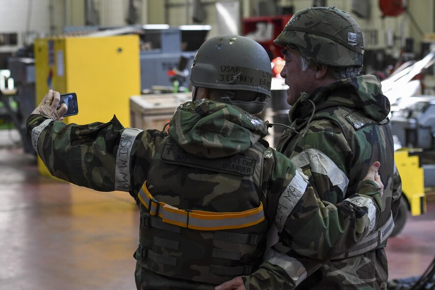 U.S. Air Force Chap. (Lt. Col.) Jeffrey Granger, 51st Fighter Wing wing chaplain, takes a selfie with a member of the 51st Maintenance Squadron aerospace ground equipment shop during Exercise Beverly Herd 17-1 at Osan Air Base, Republic of Korea, March 2, 2017. Granger and other members of the 51st FW chapel staff went across the base with offers of food and drink to help keep morale up during the exercise. (U.S. Air Force photo by Staff Sgt. Victor J. Caputo)