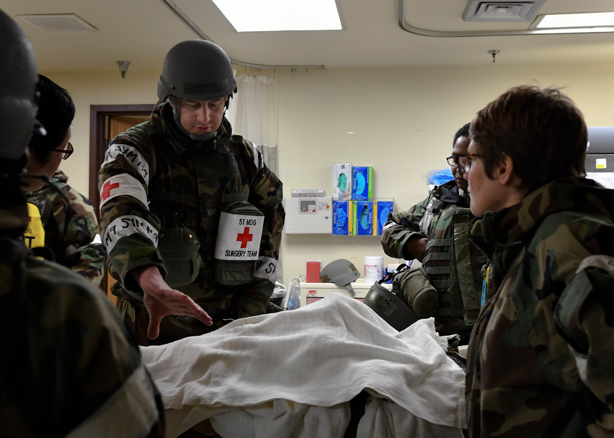 U.S. Air Force Capt. Stephen Smith, 51st Medical Operations Squadron general surgery physician assistant, helps treat an unexploded ordnance victim during Exercise Beverly Herd 17-1 at Osan Air Base, Republic of Korea, March 2, 2017. Inspiration for the scenario was drawn from U.S. Army Private Channing Moss, who was struck by a rocket-propelled grenade in eastern Afghanistan in 2006. (U.S. Air Force photo by Airman Gwendalyn Smith)