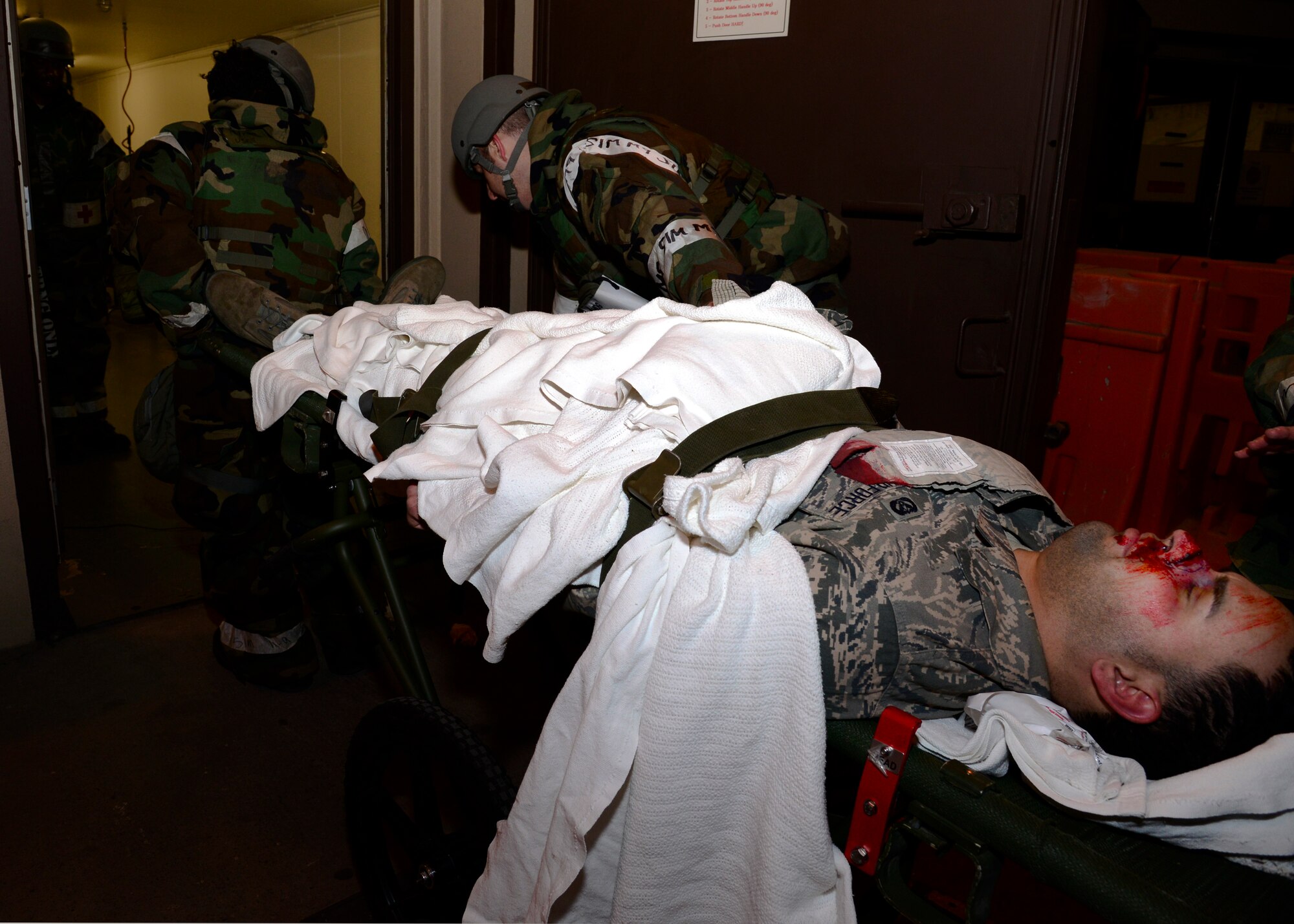 A simulated unexploded ordinance victim is rushed into the 51st Medical Group emergency room during Exercise Beverly Herd 17-1 at Osan Air Base, Republic of Korea, March 2, 2017.After the surgical team removed the unexploded ordnance medical personnel moved him inside where further treatment could be performed. (U.S. Air Force photo by Airman 1st Class Gwendalyn Smith)
