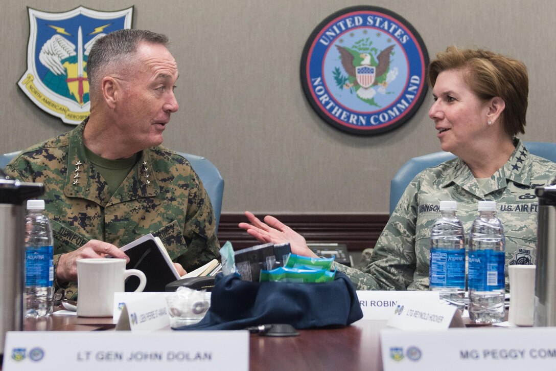 Marine Corps Gen. Joe Dunford, chairman of the Joint Chiefs of Staff, and Air Force Gen. Lori J. Robinson, commander of U.S. Northern Command, discuss North American Aerospace Defense Command and Northcom activities at Peterson Air Force Base, Colo., Mar. 1, 2017. DoD photo by D. Myles Cullen