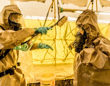 A New York City Police officer assigned to the NYPD's  Chemical Ordnance, Biological and Radiological Awareness (COBRA) unit goes through decontamination during a joint exercise with New York Army National Guard Soldiers of the 222nd Chemical Company, based at Fort Hamilton, Brooklyn, N.Y. at the NYPD's Rodman's Neck Tactical Village in the Bronx, N.Y., on Saturday  Nov. 19, 2016.The National Guard Soldiers and the members of the places of the COBRA  Training Unit used the exercise to share techniques and procedures, and enhance readiness in case of a disaster or terrorist attack. 