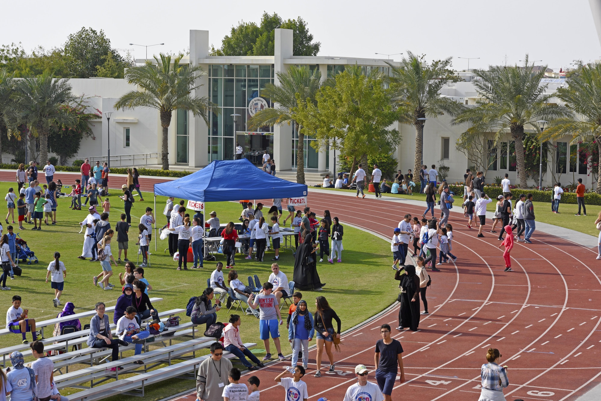 Airmen from Al Udeid Air Base, Qatar, volunteer during the annual American School of Doha 2017 Friendship Festival, Feb. 24, 2017. For 15 years, ASD has upheld the tradition of hosting this festival and has again welcomed military participation this year. (U.S. Air Force photo by Senior Airman Cynthia A. Innocenti)