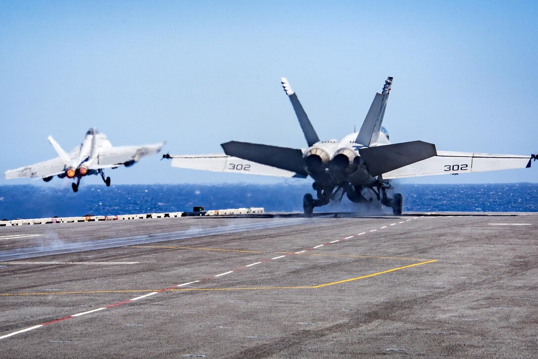 Two F/A-18 aircraft take off from the aircraft carrier USS Carl Vinson in the South China Sea, Feb. 22, 2017. The Carl Vinson Strike Group is deployed to the Western Pacific as part of the U.S. Pacific Fleet-led initiative to extend the command-and-control functions of U.S. 3rd Fleet. Navy photo by Petty Officer 2nd Class Sean M. Castellano
