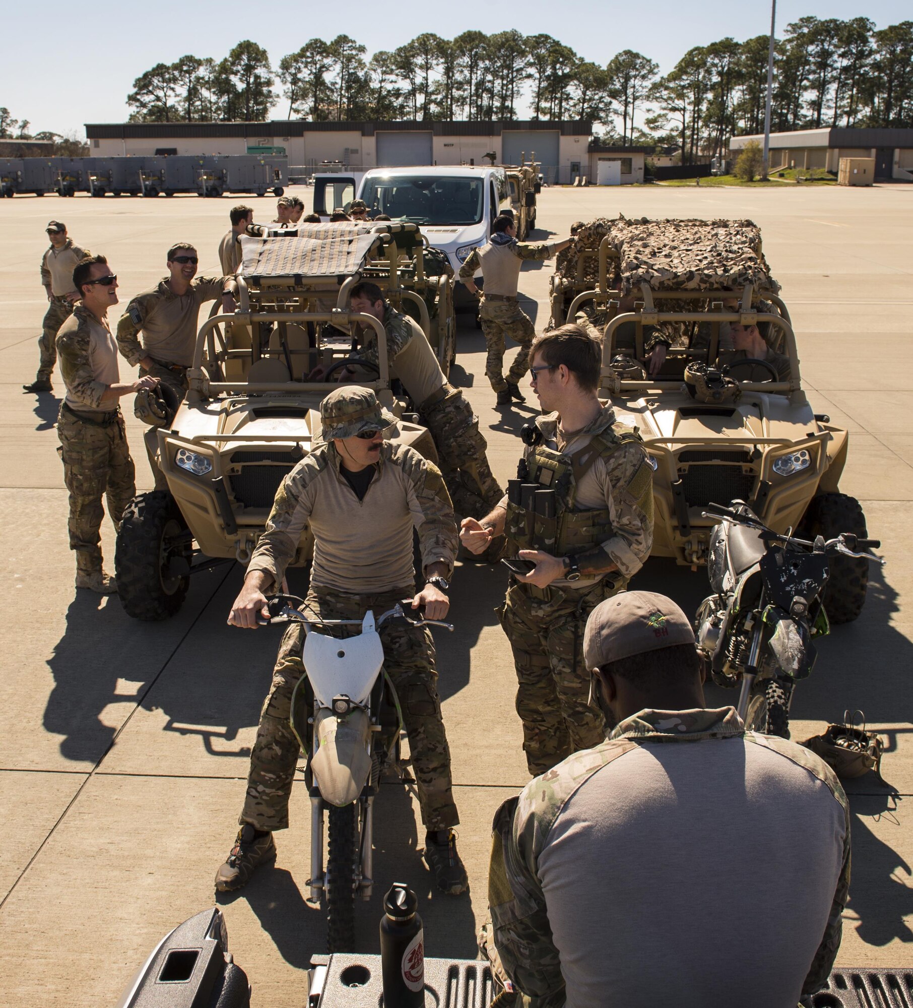 U.S. Air Force Airmen from the 24th Special Operations Wing form a line before entering an MC-130J Commando II while participating in a static load training during Exercise Emerald Warrior at Hurlburt Field, Fla., Feb. 26, 2017.  Emerald Warrior is the largest joint special operations exercise. U.S. Special Operations Command forces train to respond to various threats across the spectrum of conflict. (U.S. Air Force photo by Senior Airman Erin Piazza)