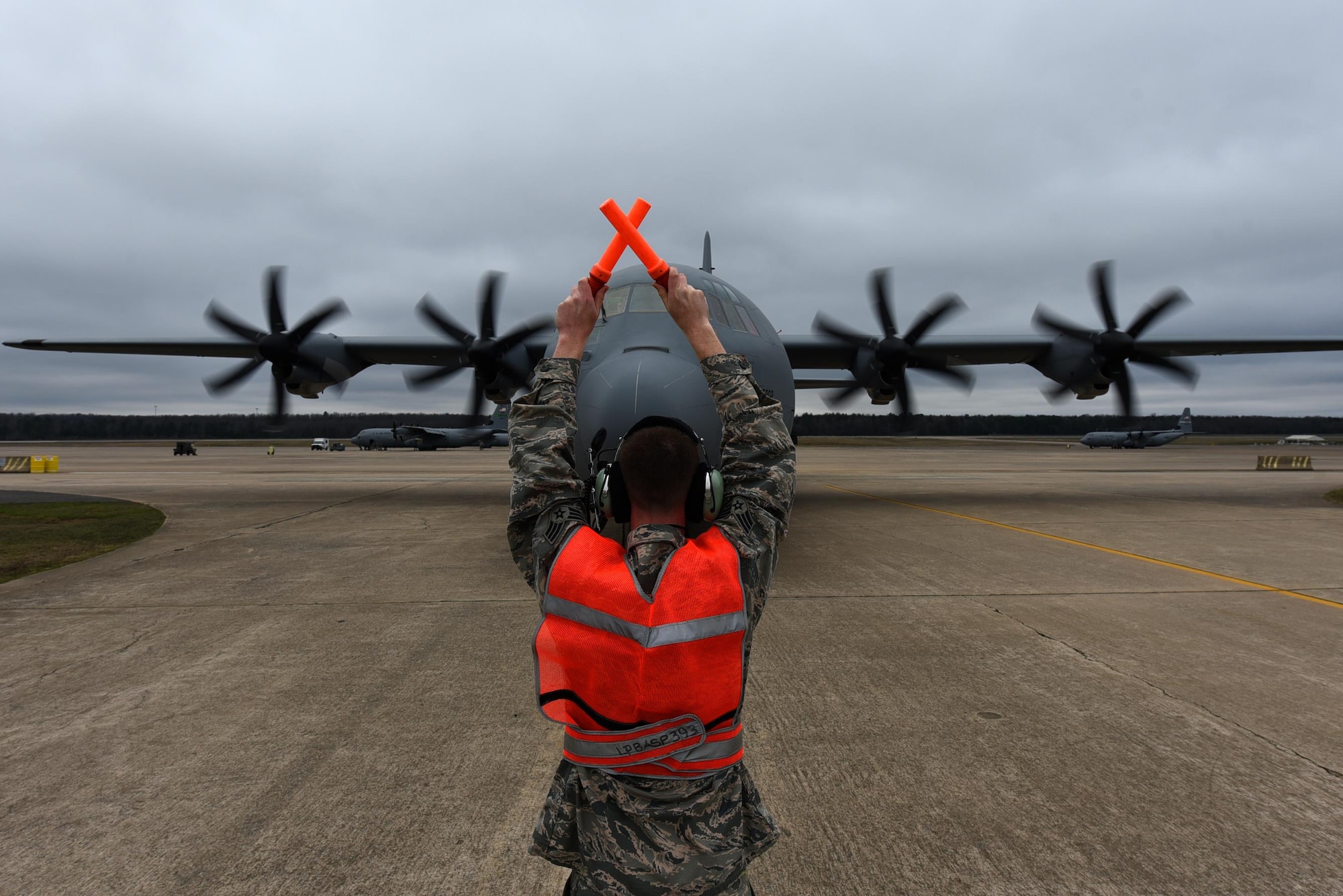 A 314th Aircraft Maintenance Squadron Airman marshals a C-130J delivered from the Lockheed Martin facility Feb. 27, 2017, at Little Rock Air Force Base, Ark. U.S. Air Force Maj. Gen. James Hecker, 19th Air Force commander, delivered the final new C-130J to the 314th Airlift Wing’s fleet, completing the H- to J-model transition for the wing. (U.S. Air Force photo by Airman 1st Class Kevin Sommer Giron)