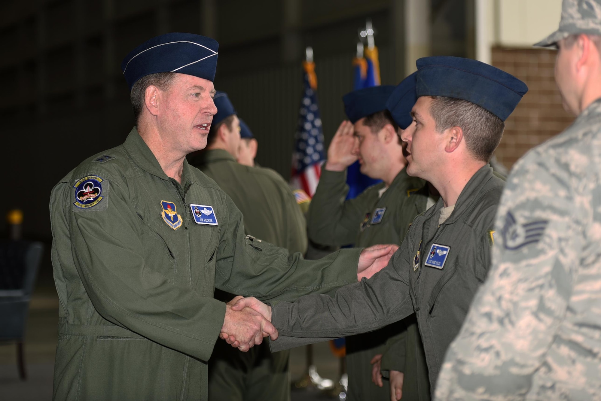 U.S. Air Force Maj. Gen. James Hecker, 19th Air Force commander, congratulates the aircrew and maintainers of the C-130J delivery team Feb. 27, 2017, at Little Rock Air Force Base, Ark. The aircrew members aided in the delivery of the newest C-130J to the 314th Airlift Wing fleet. (U.S. Air Force photo by Airman 1st Class Kevin Sommer Giron)