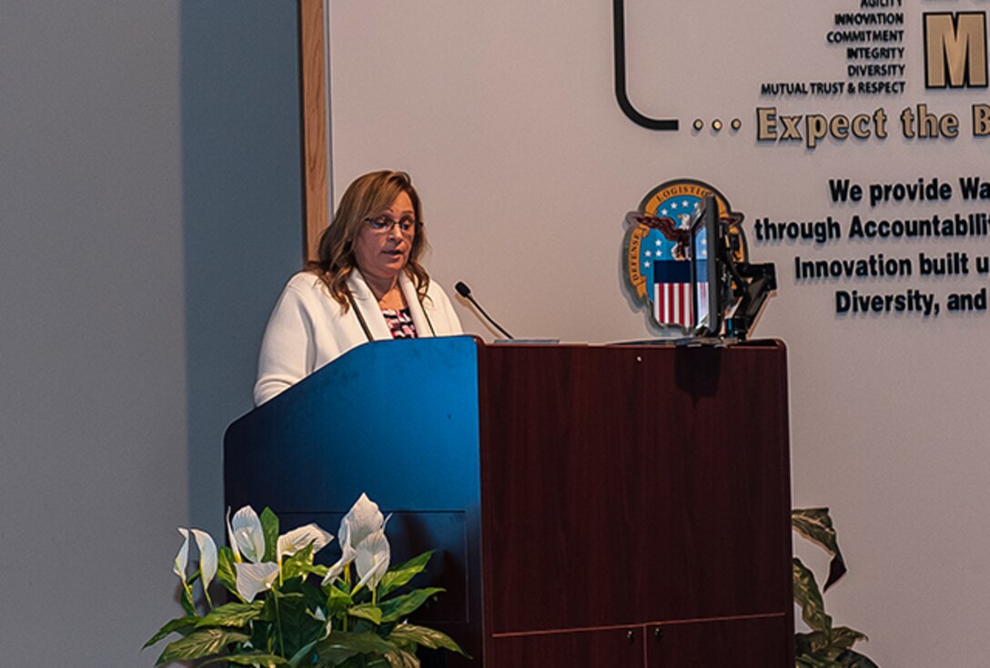 JoAnn Phillips, guest speaker and program graduate, addresses her class of 31 DLA Land and Maritime protégés. 