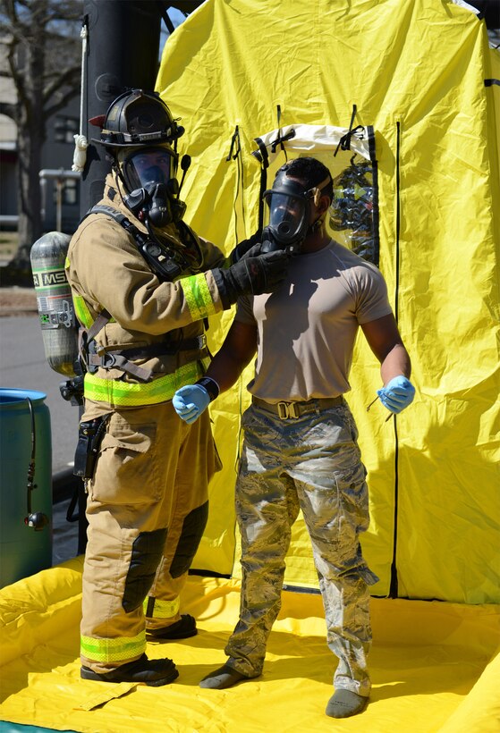 A firefighter assigned to the Fort Eustis Fire Department removes safety gear from a U.S. Air Force Explosive Ordnance Disposal member during a chemical, biological, radiological, nuclear and explosives exercise at Joint Base Langley-Eustis, Va., Feb. 23, 2017. First responders must carefully remove protective gear in order to reduce exposure to CBRNE hazards.
(U.S. Air Force photo by Tetaun Moffett)
