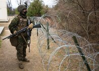 Lance Cpl. David Paul, 2nd platoon, Company A, Fleet Anti-Terrorism Support Team, Marine Corps Security Force Regiment, patrols the perimeter during a site-security exercise aboard Naval Weapons Station Yorktown, Yorktown, Va., Feb. 15, 2017, in preparation for a deployment to Yokosuka, Japan. The Marines conducted fixed-site security operations to ensure they were prepared to take on the challenge of reinforcing embassies within their area of operations in the event of an emergency. (Official U.S. Marine Corps photo by Sgt. Calvin Shamoon/ Released) 