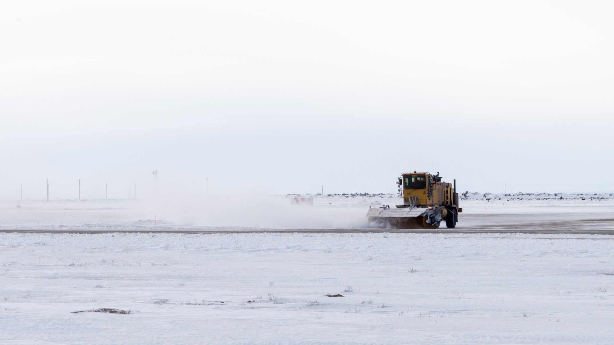 A 366th Civil Engineer Squadron airman sweeps the streets at Mountain Home Air Force Base, Idaho, Feb. 28, 2017. Mountain Home AFB broke the 1985 snowfall record of 33.4 inches by 2.2 inches thus far. (U.S. Air Force photo by Senior Airman Connor Marth/Released)