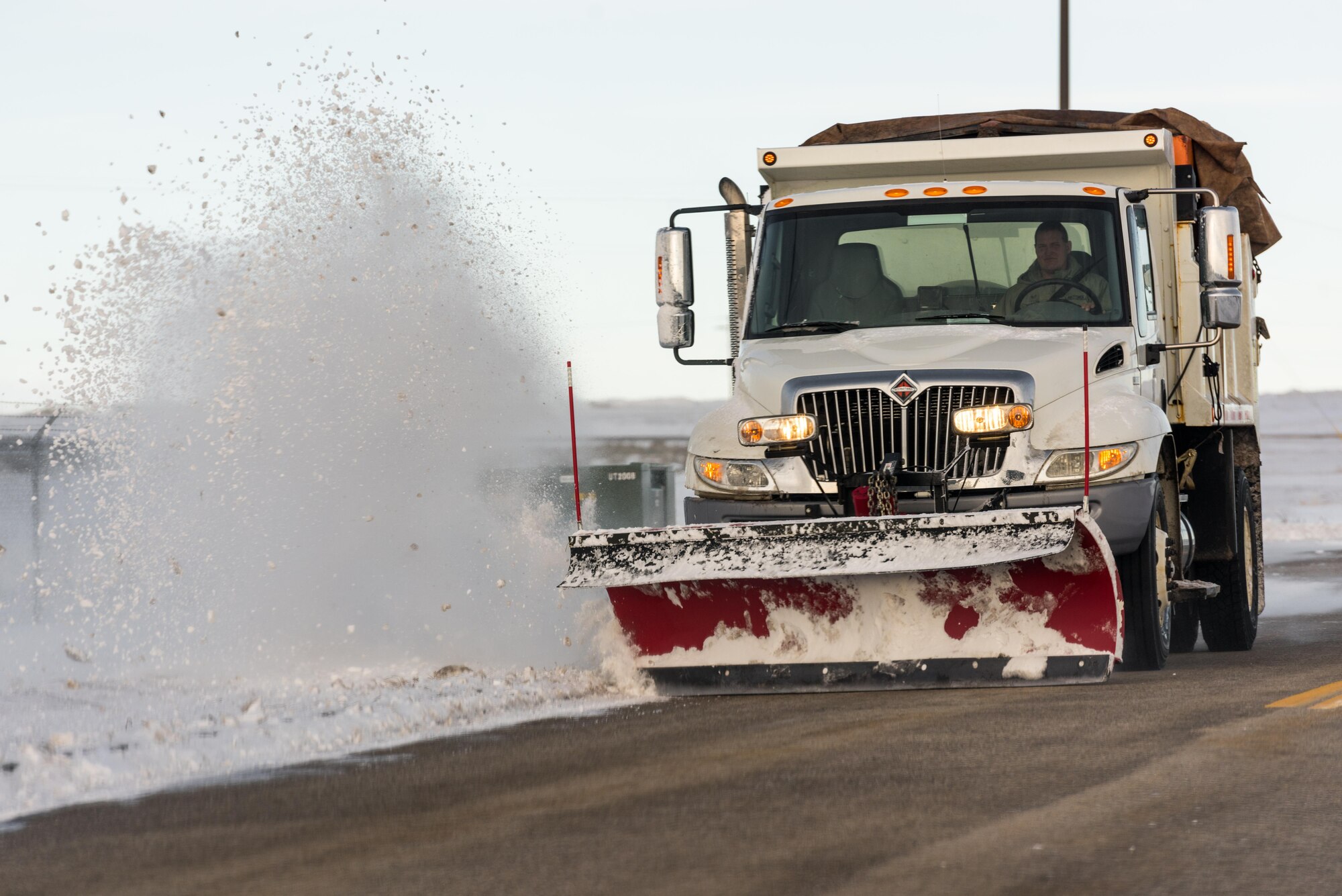 A 366th Civil Engineer Squadron airman plows snow on the roads at Mountain Home Air Force Base, Idaho, Feb. 28, 2017. Mountain Home AFB has experienced a record snow fall this season with 35.6 inches of snow. (U.S. Air Force photo by Senior Airman Connor Marth/Released)
