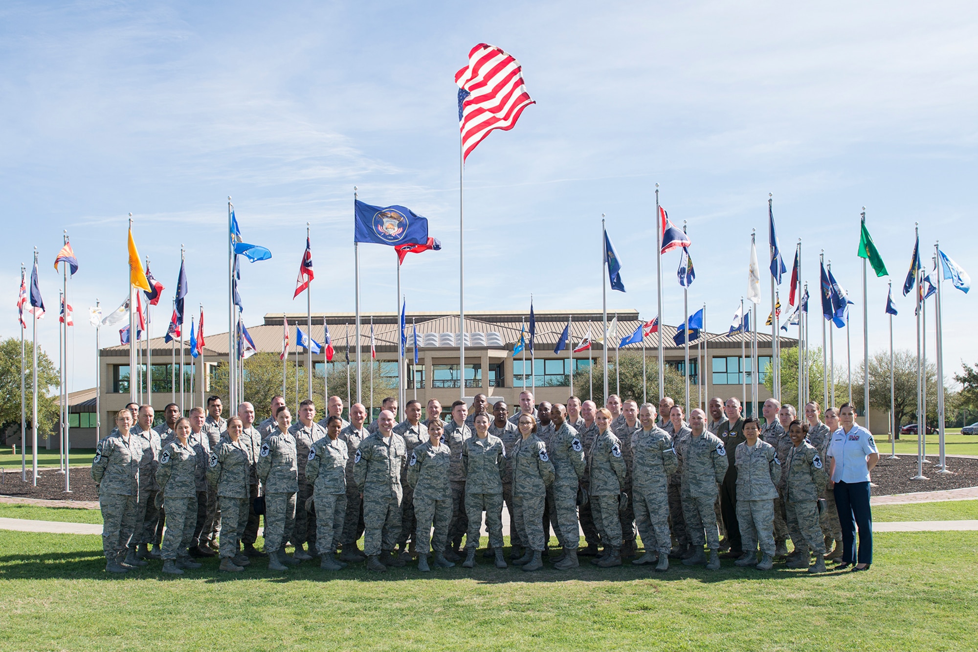 The 2017 Joint Base San Antonio-Lackland senior master sergeant selects pose for a group photo at the 37th Training Wing parade field March 2, 2017. The Air Force selected 1,391 master sergeants for promotion, with an overall selection rate of 11.8 percent.