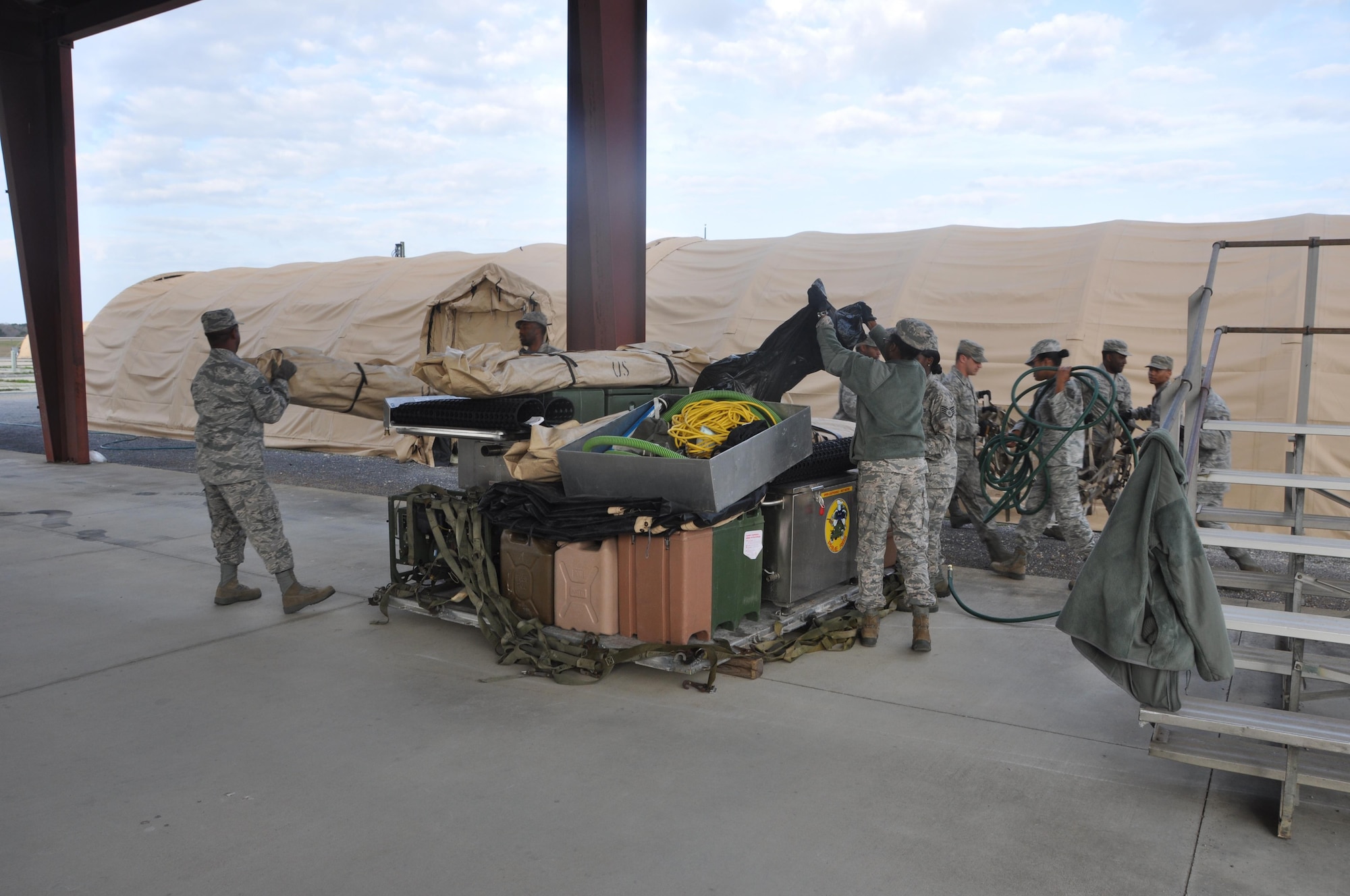 Members of the 908th Airlift Wing’s Force Support Squadron unload a pallet at the start of the Hennessy Competition Feb. 11 at Maxwell Air Force Base. The 908th is one of four teams competing for the John L. Hennessy Award that recognizes those who best excel in food service. (U.S. Air Force photo by Bradley J. Clark)