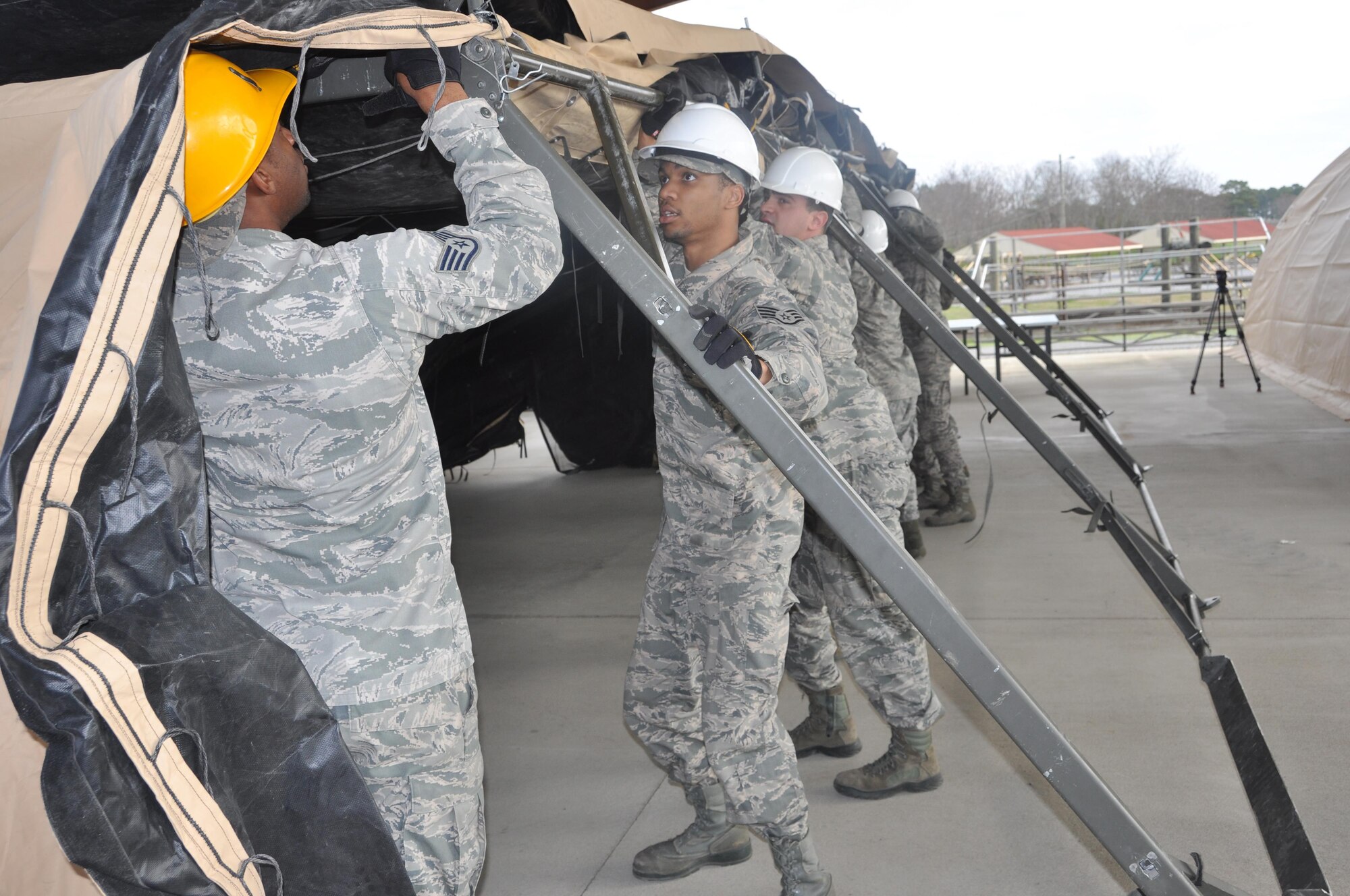 Members of the 908th Airlift Wing’s Force Support Squadron assemble a combat kitchen as part of the Hennessy Competition Feb. 11 at Maxwell Air Force Base. The 908th is one of four teams competing for the John L. Hennessy Award that recognizes those who best excel in food service. (U.S. Air Force photo by Bradley J. Clark)