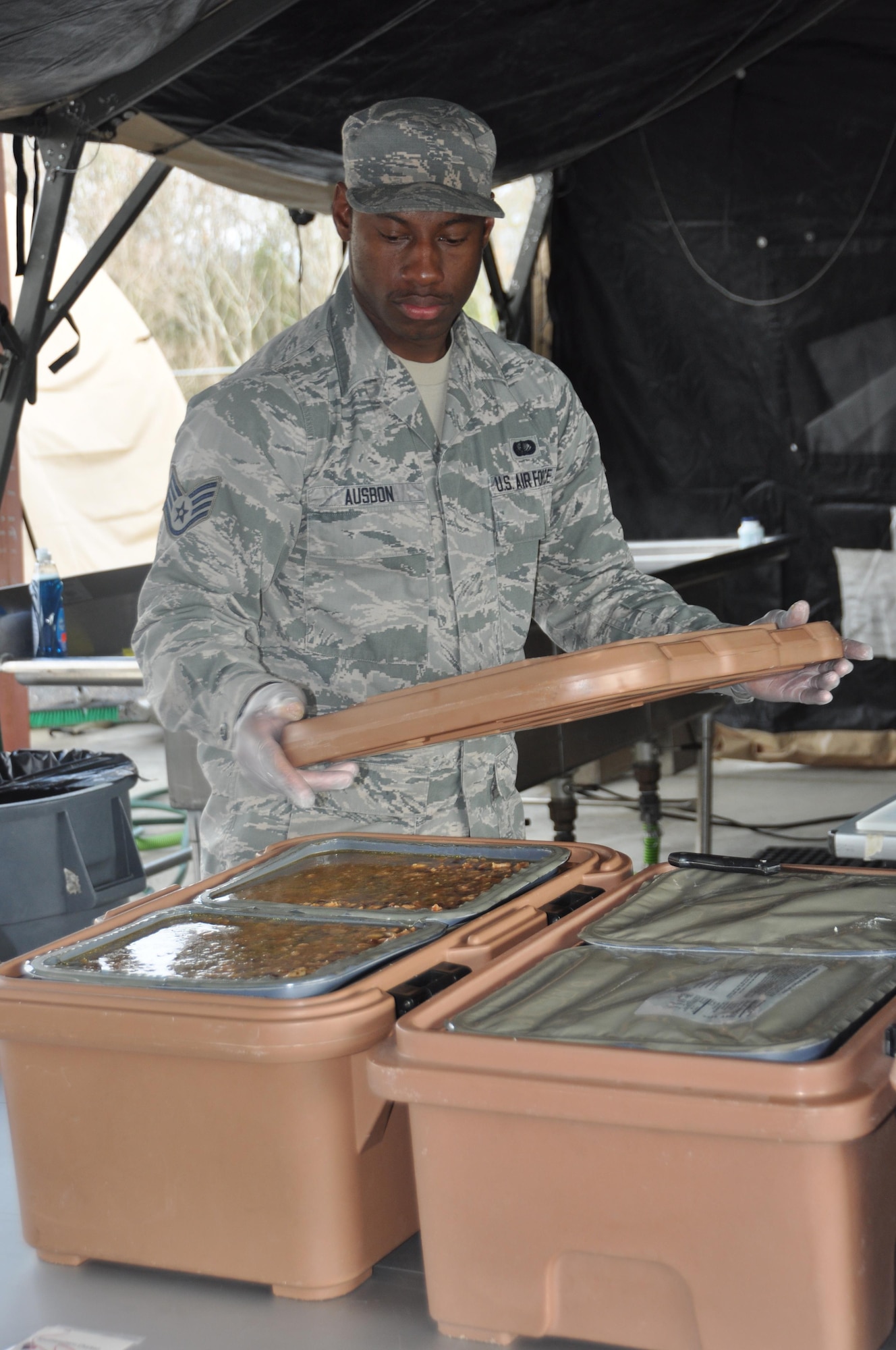 Staff Sgt. Octavius Ausbon, member of the 908th Airlift Wing’s Force Support Squadron, prepares to cover food during the Hennessy Competition Feb. 11 at Maxwell Air Force Base. Ausbon won the individual Outstanding Performer award last year while competing for the John L. Hennessy Award that recognizes those who best excel in food service. (U.S. Air Force photo by Bradley J. Clark