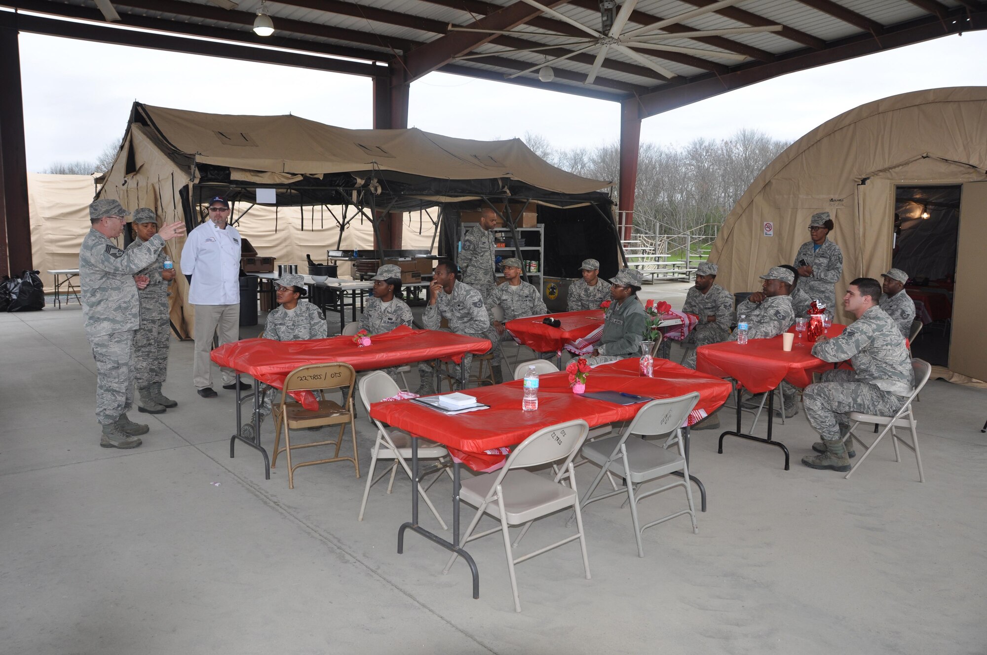 Three judges representing the Air Force Reserve Command give feedback to the 908th Airlift Wing’s team that had just finished competing for the John L. Hennessy Award Feb. 11 at Maxwell Air Force Base. The 908th is one of four teams vying for the award that recognizes the team who best excels in food service. (U.S. Air Force photo by Bradley J. Clark)