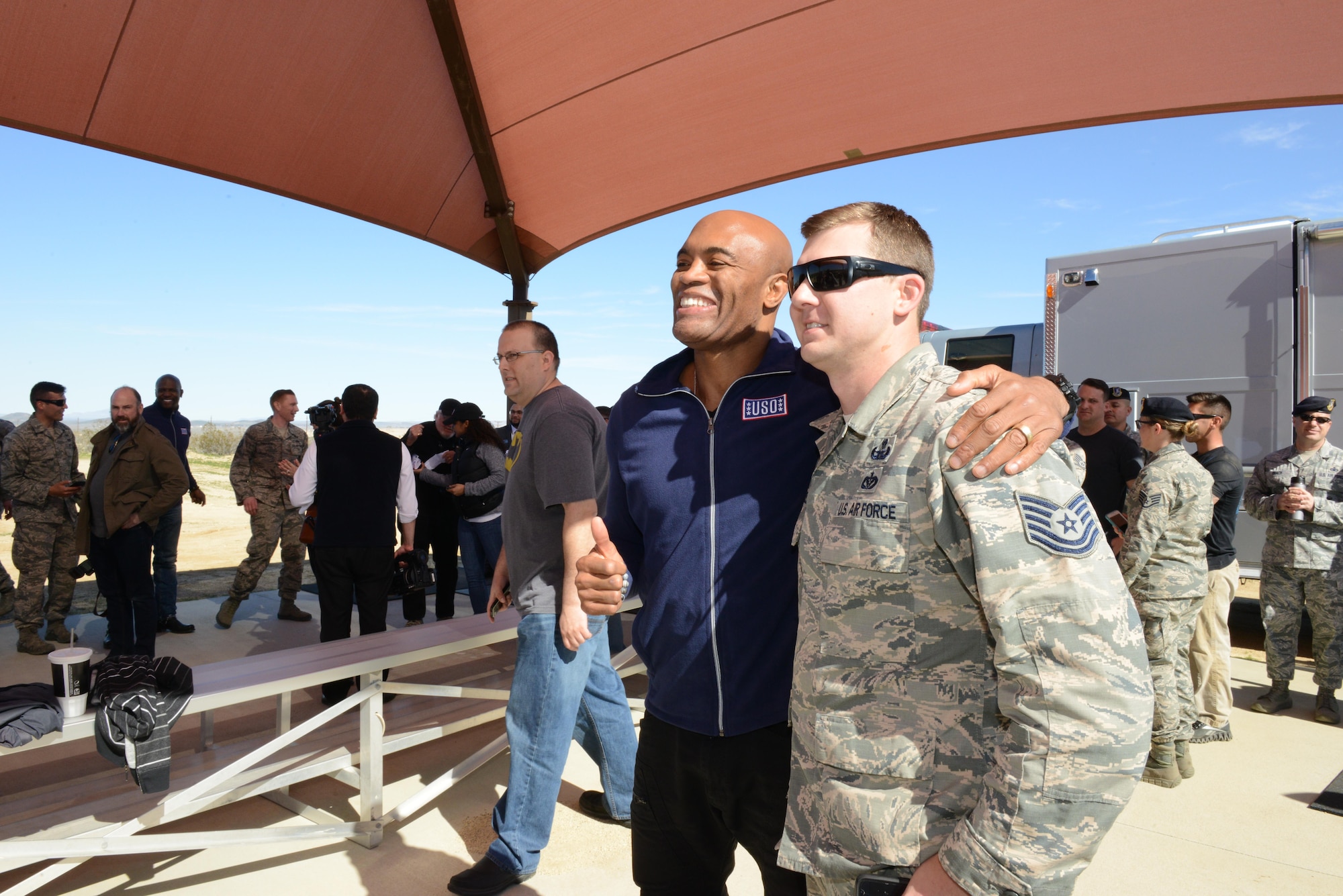Mixed martial arts fighter Anderson Silva posed for photos with Airmen Feb. 24. Silva is one of the hosts of a new Netflix show called the "Ultimate Beastmaster." (U.S. Air Force photo by Kenji Thuloweit)