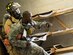 A firefighter with the 96th Civil Engineer Group, drags a U.S. Army 7th Special Forces Group (A) participant to safety during an exercise Feb. 23 at Eglin Air Force Base, Fla. The simulated detonation scenario tested firefighters, security forces and medical emergency response personnel agencies among others. (U.S. Air Force photo/Ilka Cole)