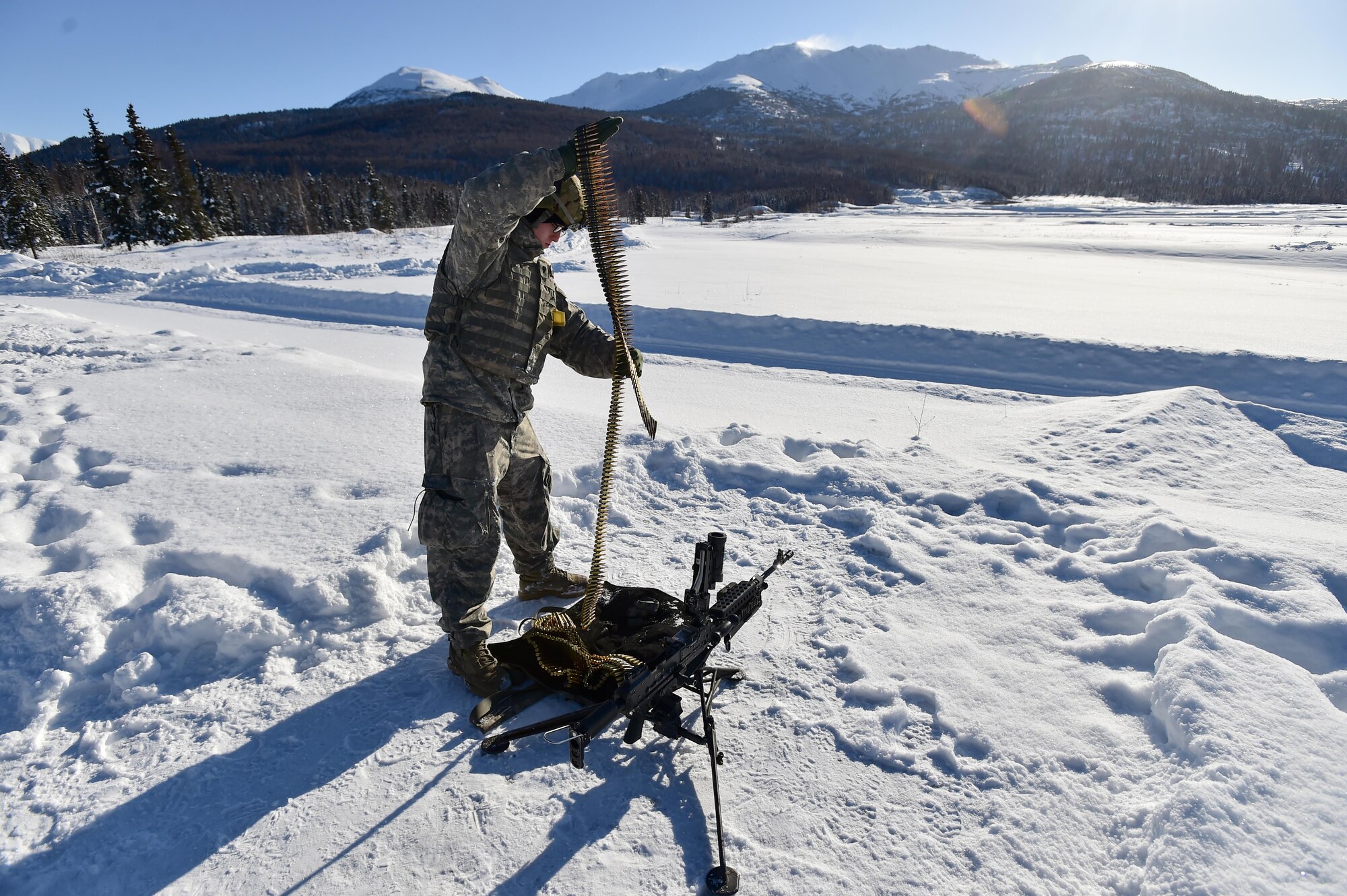 Army Spc. Timothy Sampson, a native of Lancaster, Calif., assigned Delaware Company, 1st Battalion, 501st Parachute Infantry Regiment, 4th Infantry Brigade Combat Team (Airborne), 25th Infantry Division, U.S. Army Alaska, waits to qualify with a M240B machine gun on Grezelka range at Joint Base Elmendorf-Richardson, Alaska, Feb 28, 2017. U.S. Army Alaska is home to the Army’s only Pacific airborne brigade combat team, and maintains the only airborne rapid-response capacity within the Pacific Command. (U.S. Air Force photo/Justin Connaher)