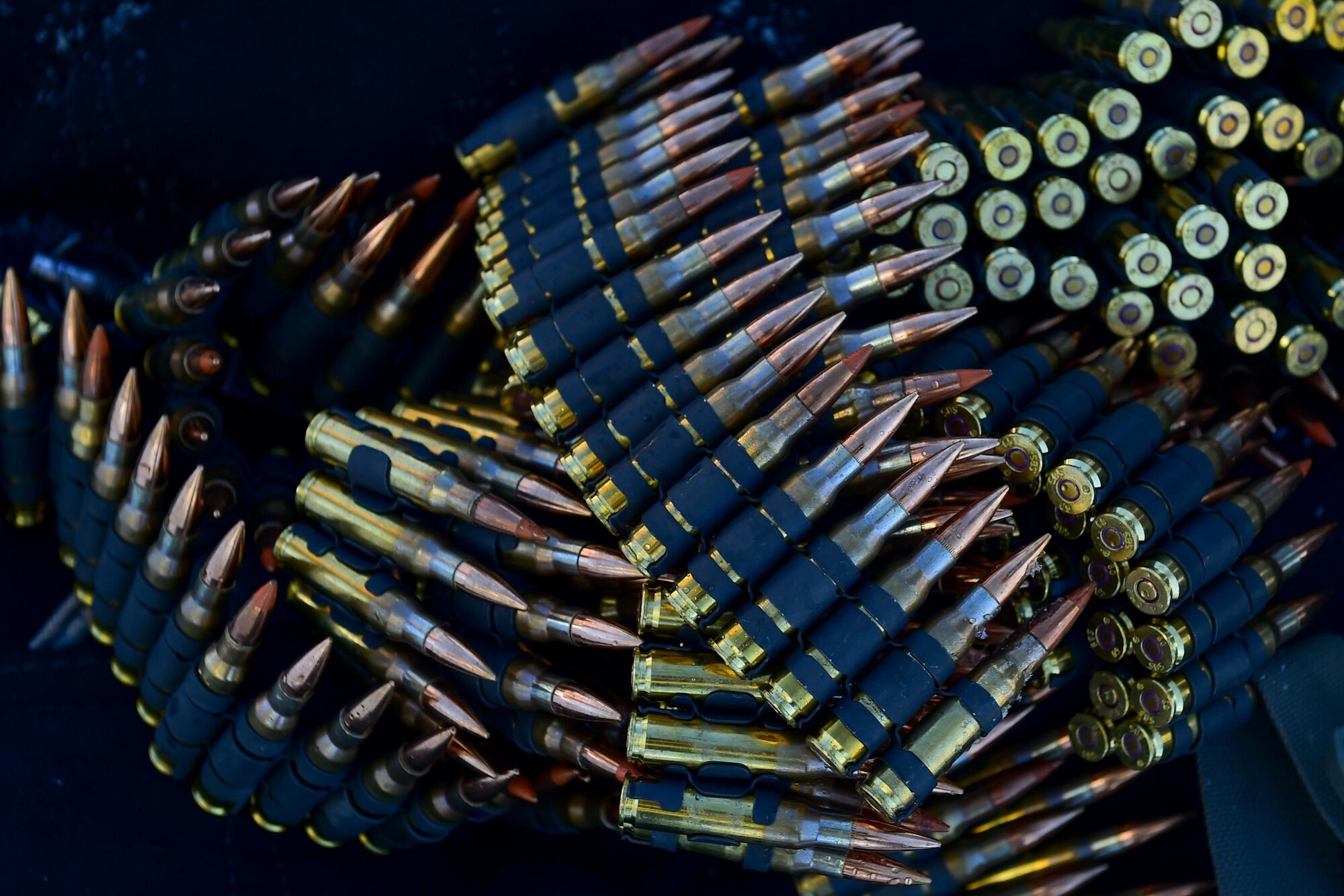 Linked 7.62 mm ammunition for M240B machine guns lays on the ground before paratroopers assigned the 4th Infantry Brigade Combat Team (Airborne), 25th Infantry Division, U.S. Army Alaska, qualify on Grezelka range at Joint Base Elmendorf-Richardson, Alaska, Feb 28, 2017. U.S. Army Alaska is home to the Army’s only Pacific airborne brigade combat team, and maintains the only airborne rapid-response capacity within the Pacific Command. (U.S. Air Force photo/Justin Connaher)