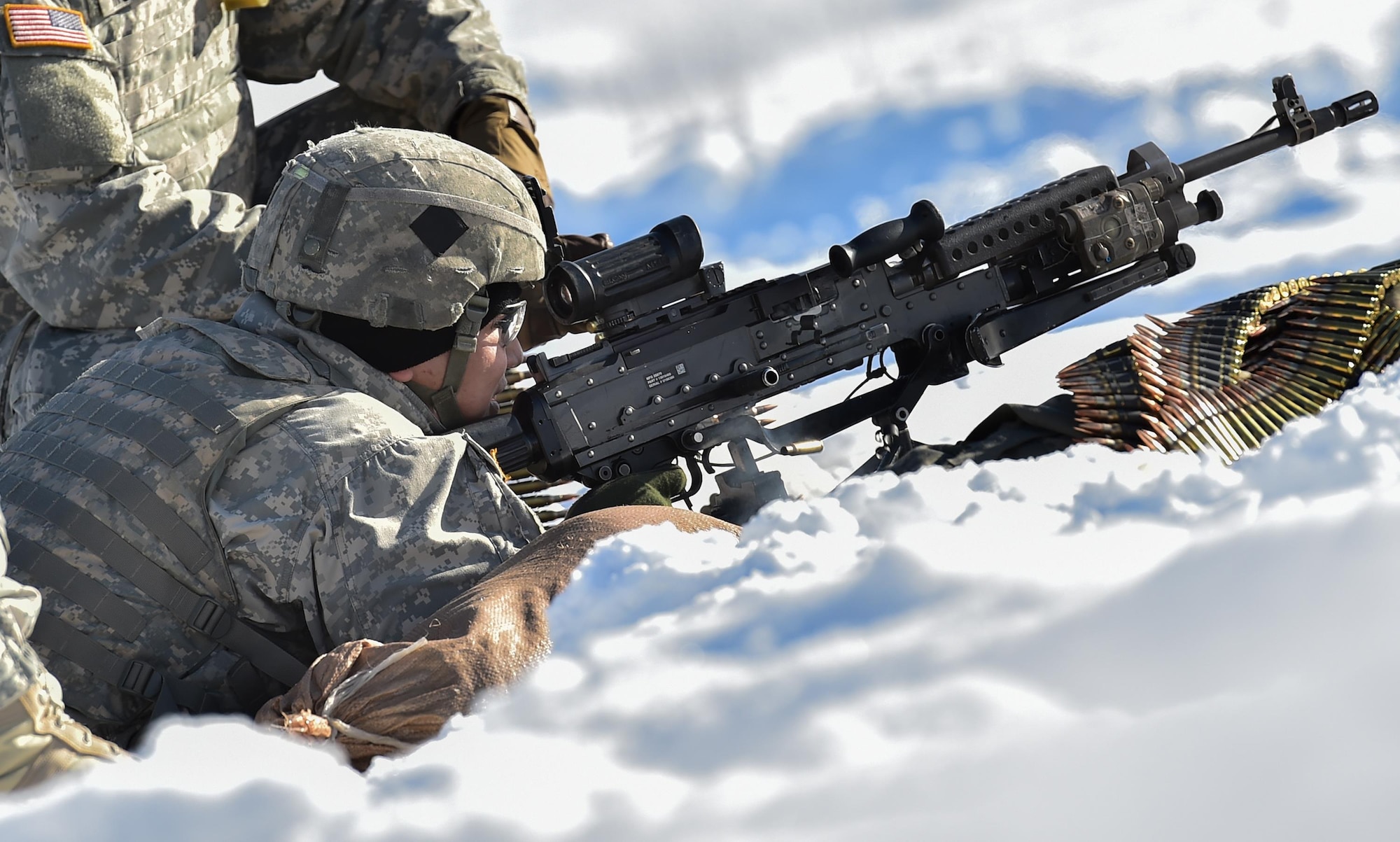 A paratrooper assigned the 1st Battalion, 501st Parachute Infantry Regiment, 4th Infantry Brigade Combat Team (Airborne), 25th Infantry Division, U.S. Army Alaska, qualifies with a M240B machine gun on Grezelka range at Joint Base Elmendorf-Richardson, Alaska, Feb 28, 2017. U.S. Army Alaska is home to the Army’s only Pacific airborne brigade combat team, and maintains the only airborne rapid-response capacity within the Pacific Command. (U.S. Air Force photo/Justin Connaher)