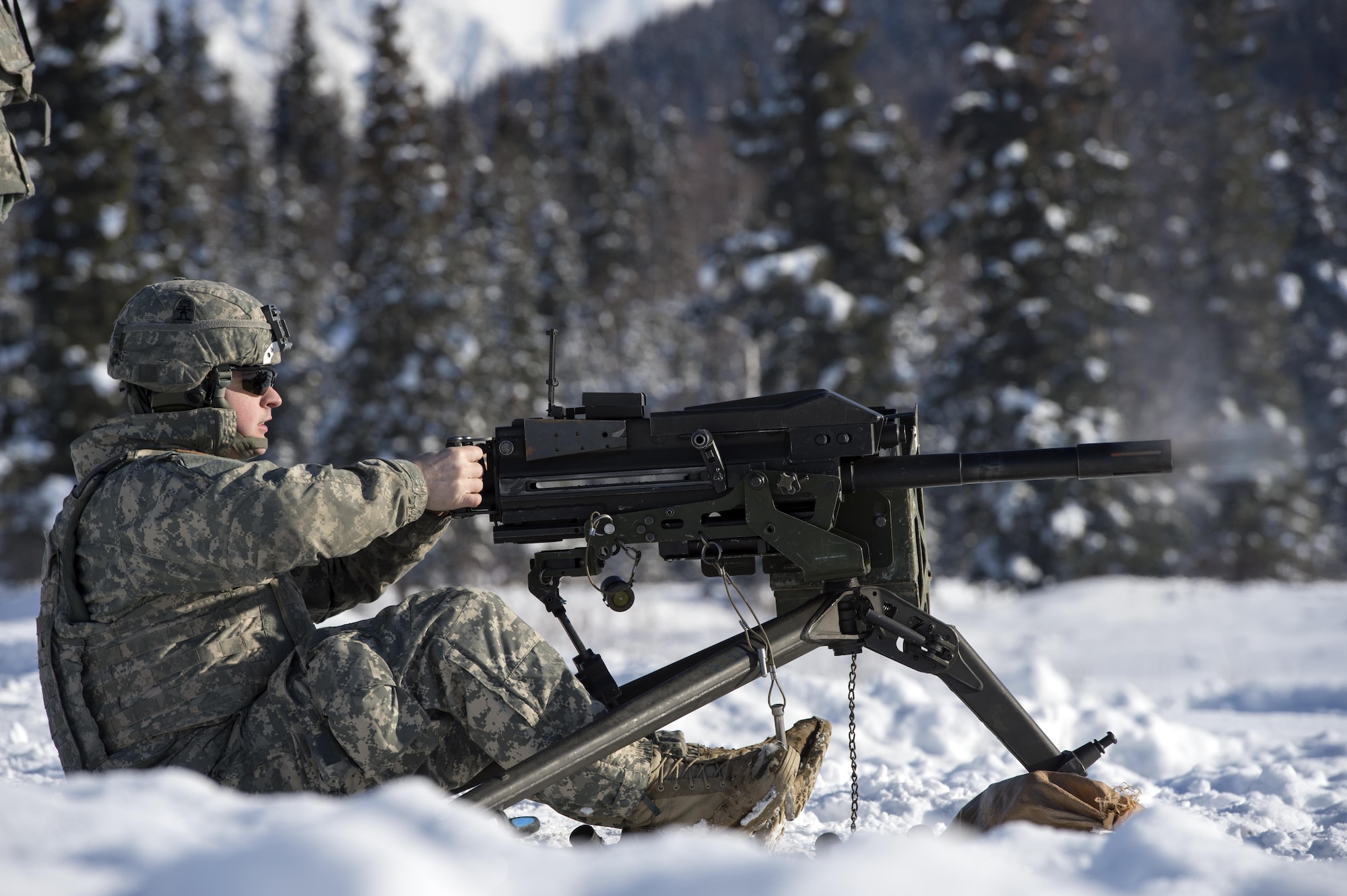 Spc. Tyler Denny, assigned to Dog Company, 3rd Battalion, 509th Parachute Infantry Regiment, 4th Infantry Brigade Combat Team (Airborne), 25th Infantry Division, U.S. Army Alaska, fires a Mark 19 40 mm grenade machine gun while conducting live-fire training at Grezelka range, Joint Base Elmendorf-Richardson, Alaska, Feb. 28, 2017. The paratroopers practiced engaging targets at varying distances utilizing the M240B machine gun and the Mark 19 40 mm grenade machine gun. (U.S. Air Force photo/Alejandro Pena)
