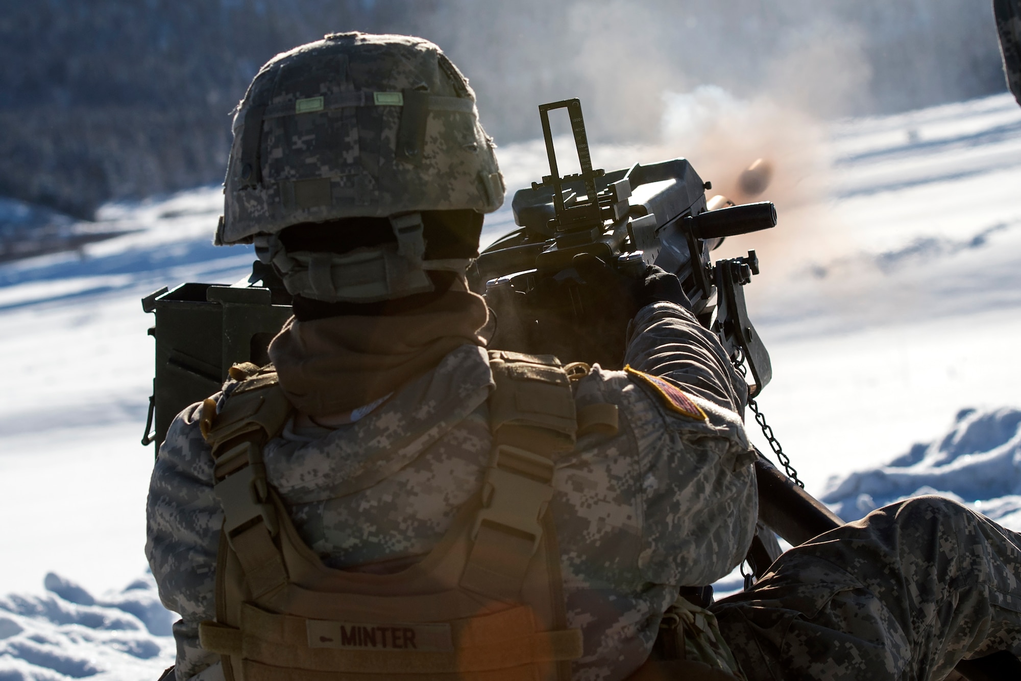 Spc. Joshua Minter, assigned to Dog Company, 3rd Battalion, 509th Parachute Infantry Regiment, 4th Infantry Brigade Combat Team (Airborne), 25th Infantry Division, U.S. Army Alaska, fires a Mark 19 40 mm grenade machine gun while conducting live-fire training at Grezelka range, Joint Base Elmendorf-Richardson, Alaska, Feb. 28, 2017. The paratroopers practiced engaging targets at varying distances utilizing the M240B machine gun and the Mark 19 40 mm grenade machine gun. (U.S. Air Force photo/Alejandro Pena)