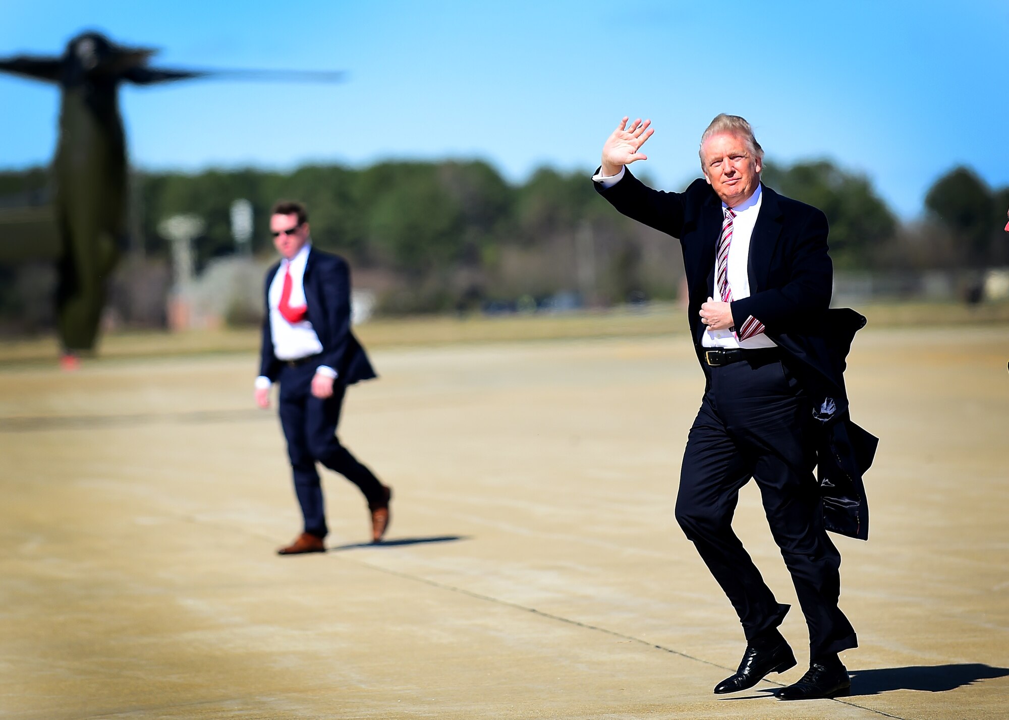 President Donald J. Trump is greeted by Maj. Gen. John K. McMullen, Air Combat Command vice commander, Col. Caroline Miller, 633rd Air Base Wing commander, and Col. Peter Fesler, 1st Fighter Wing commander at Joint Base Langley-Eustis, Va., March 2, 2017. The 633rd ABW is the host wing to 24,000 Airmen, Soldiers and civilians who support 11 major units, one of which is the 1st FW, whose mission is to deliver stealth, combat airpower world-wide on short notice to combatant commanders. (U.S. Air Force photo by Senior Airman Areca T. Bell)