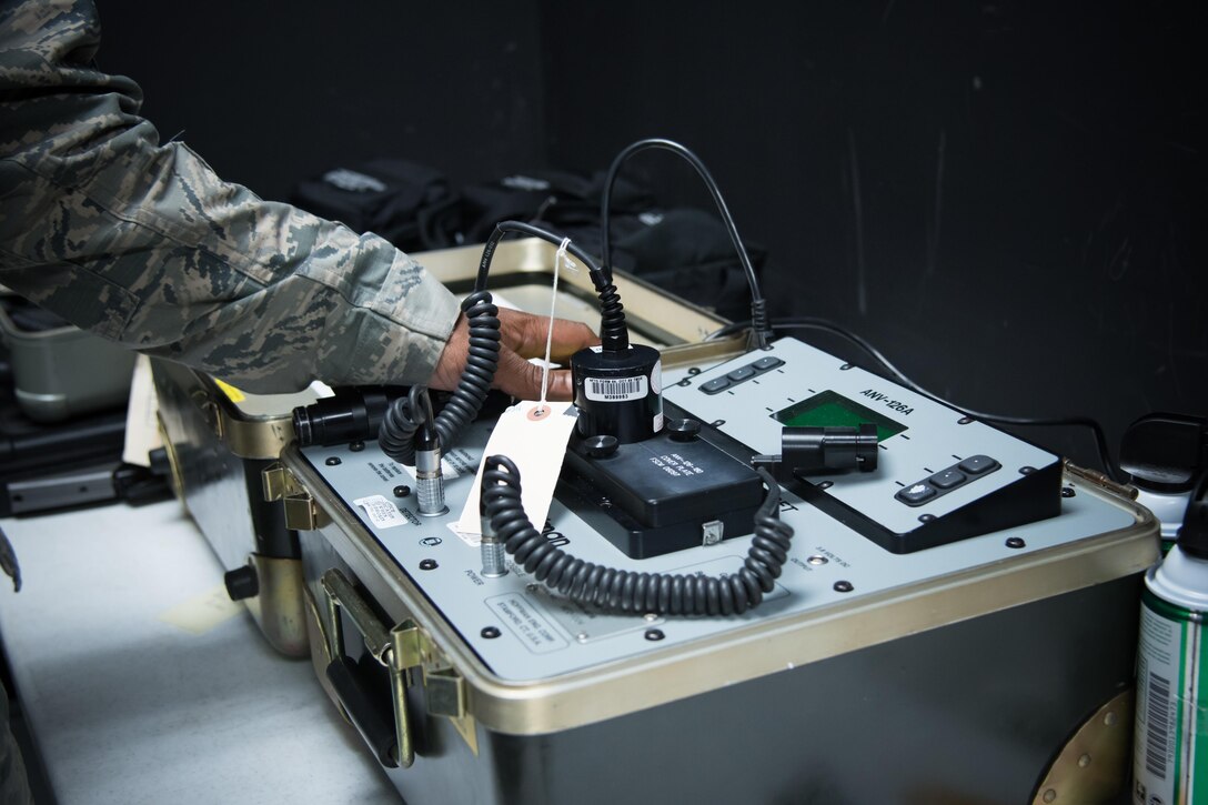 Master Sgt. Ray Reynolds, 403rd Operations Support Squadron aircrew flight equipment supervisor, inspects a pair of night vision goggles Feb. 22 at Keesler Air Force Base, Mississippi. (U.S. Air Force photo/Staff Sgt. Heather Heiney) 