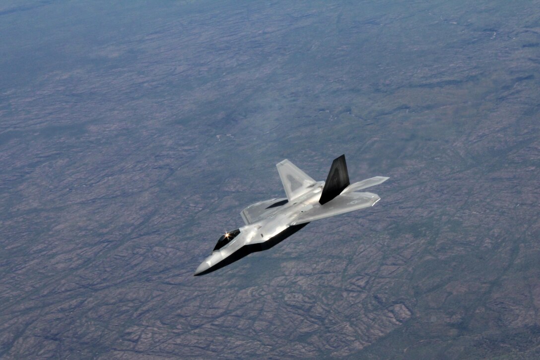 A U.S. Air Force F-22 Raptor flies above Royal Australian Air Force Base Tindal, Australia, March 2, 2017. Twelve F-22 Raptors and approximately 200 U.S. Air Force Airmen participated in the first Enhanced Air Cooperation, an initiative under the Force Posture Agreement between the U.S. and Australia. (U.S. Air Force photo by Maj. Lori Hodge)